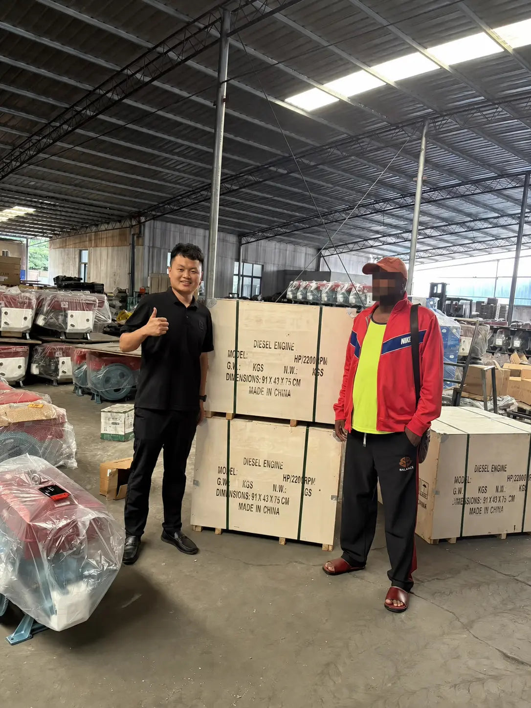 International buyer reviewing AOKAI diesel engines and wooden packing cases